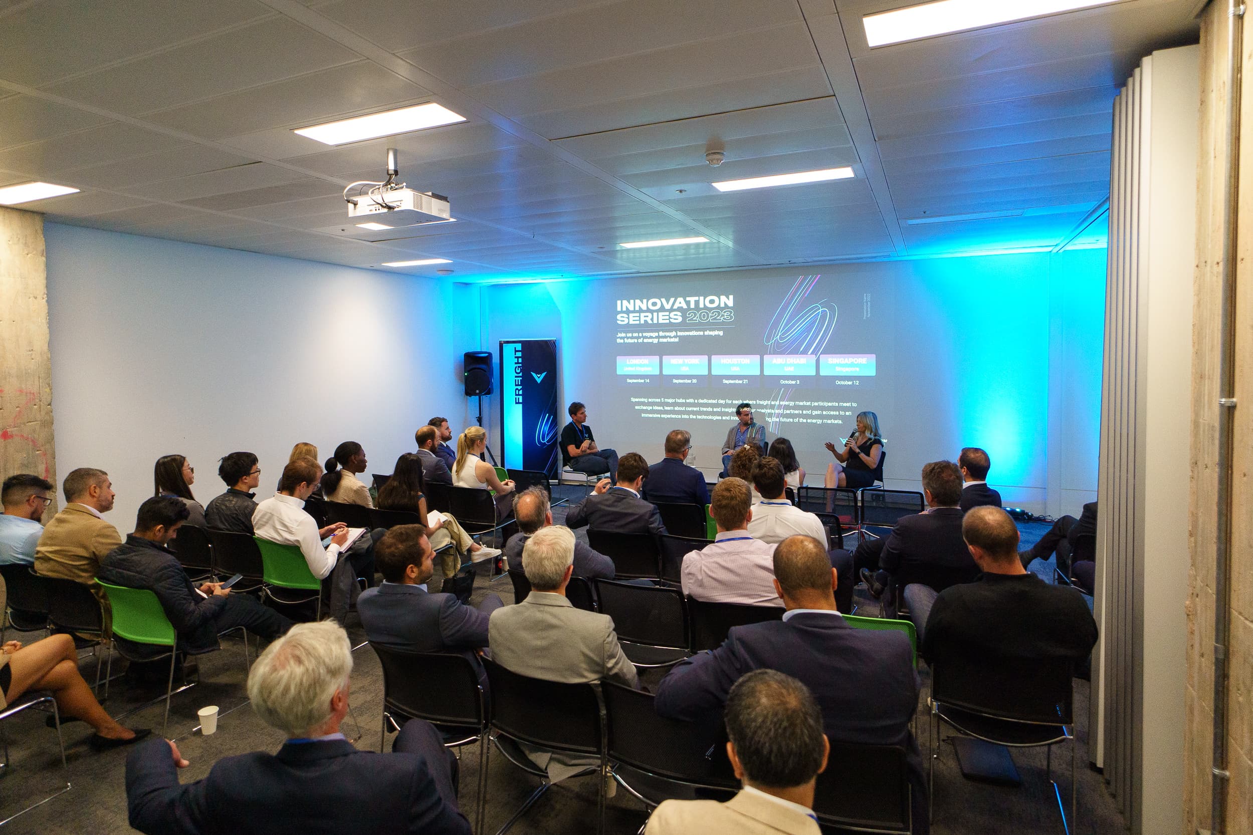 Close-up of attendees engaged in discussion during a break at the London 2023 event.