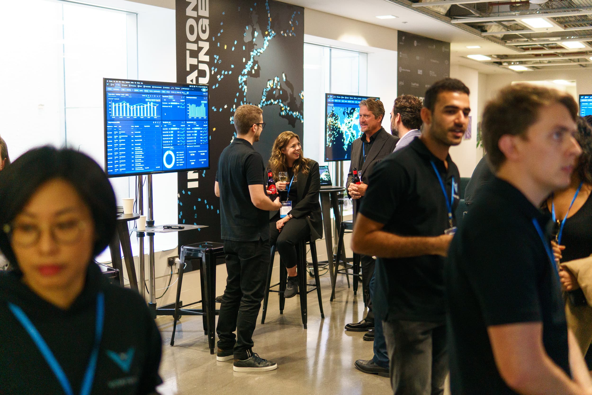 Networking session with drinks at the Vortexa Innovation Series London 2023 venue.