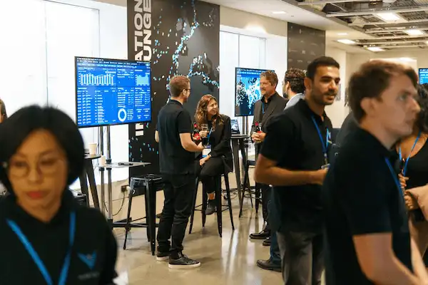 Networking session with drinks at the Vortexa Innovation Series London 2023 venue.